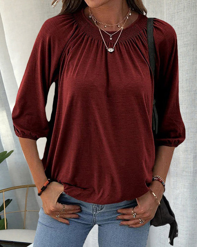 Blouses with a round neck and three-quarter sleeves