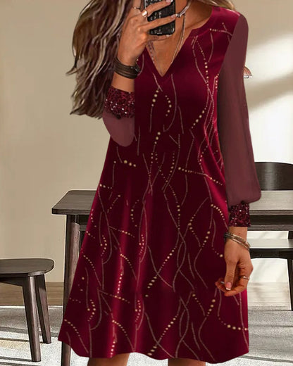 Loose, casual long-sleeved dress with a V-neck