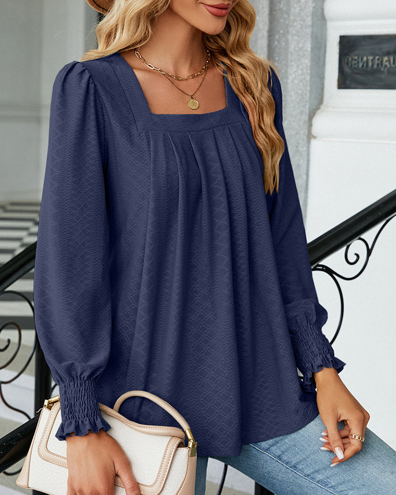 Solid color top with a square neckline