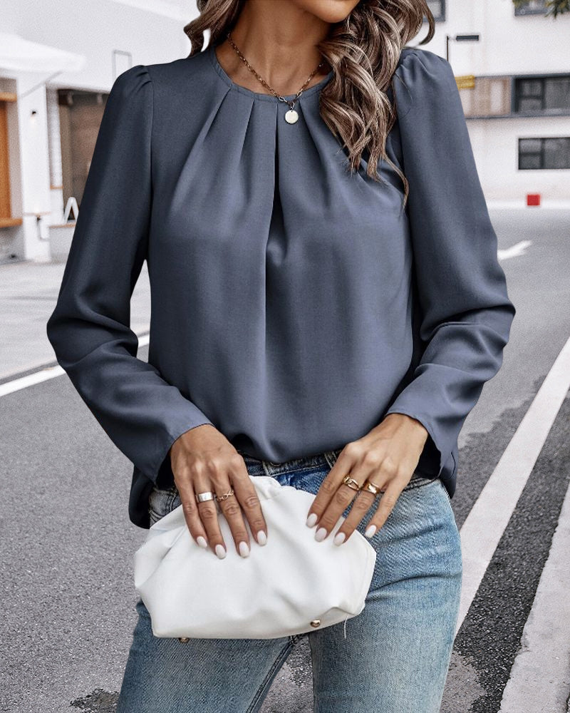 Plain pleated blouse with puff sleeves