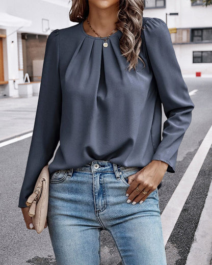 Plain pleated blouse with puff sleeves
