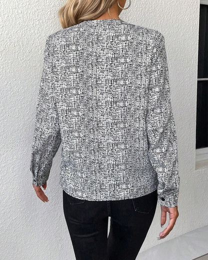 Printed, elegant long-sleeved blouse with a V-neck
